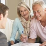 Old couple signing paperwork related to an SSDI claim_s
