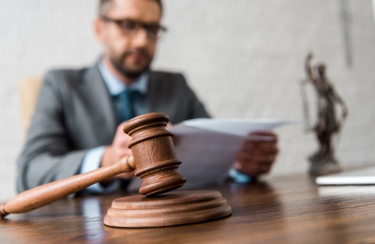 Judge sitting with a gavel