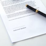 A document with a pen on top_s