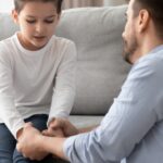 Father holding son’s hands_s