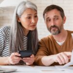 Older couple looking at paperwork_s