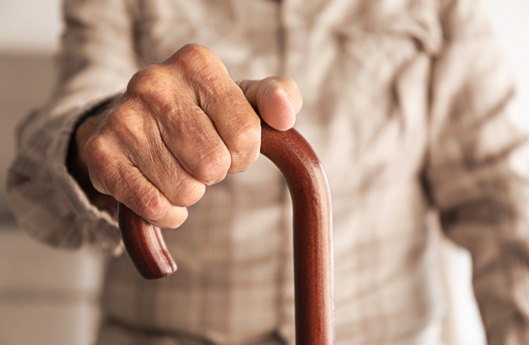 elderly man with a cane