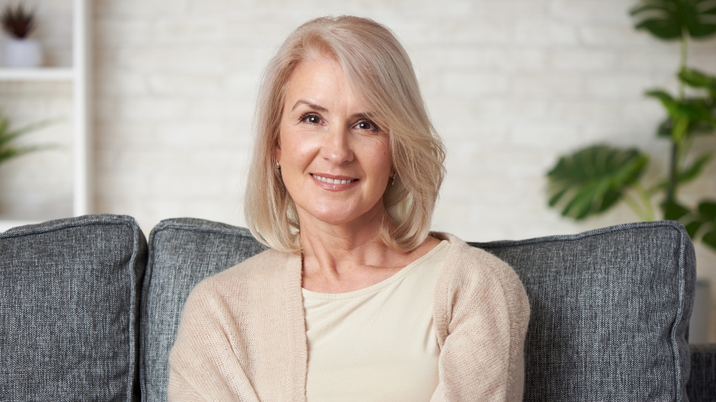 woman on couch being happy