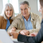 Senior,Couple,Meeting,Financial,Adviser,For,Investment
