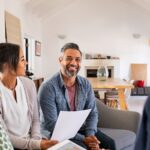 Happy couple discussing estate planning