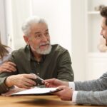 Notary consulting senior couple about probate