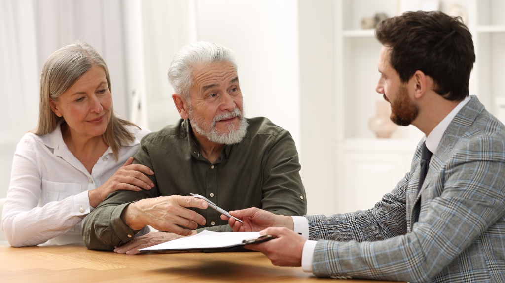 Notary consulting senior couple about probate