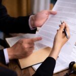 client and lawyer are reviewing documents_s