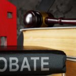 Probate law book and model of house on it_s (1)
