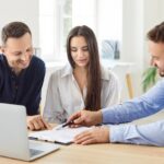 Young couple is consulting with estate planning lawyer_s