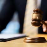 Lawyer is holding judge’s gavel_s