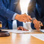 A team meeting of business people and a lawyer in formal suits is taking place at a desk_s (1)
