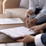 Real estate agent explaining and let customers sign a house purchase contract_s (3)