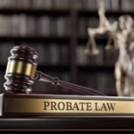 A wooden judge’s gavel resting beside a “PROBATE LAW” plaque_s